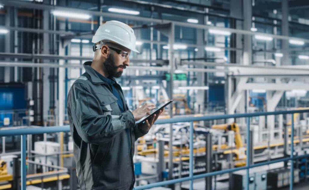 Industrial technician performing precision instrument calibration in a certified SR Unique Solutions laboratory.